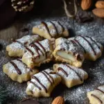 Nougat-Spitzbuben - M&uuml;rbe Pl&auml;tzchen mit Nougat